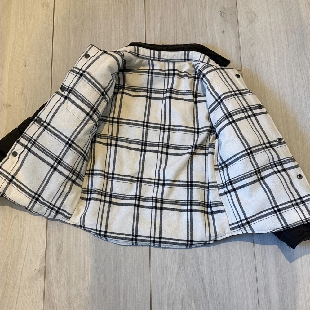 IKKS brand Kids Reversible Black Puffer Jacket, interior soft cream plaid, size